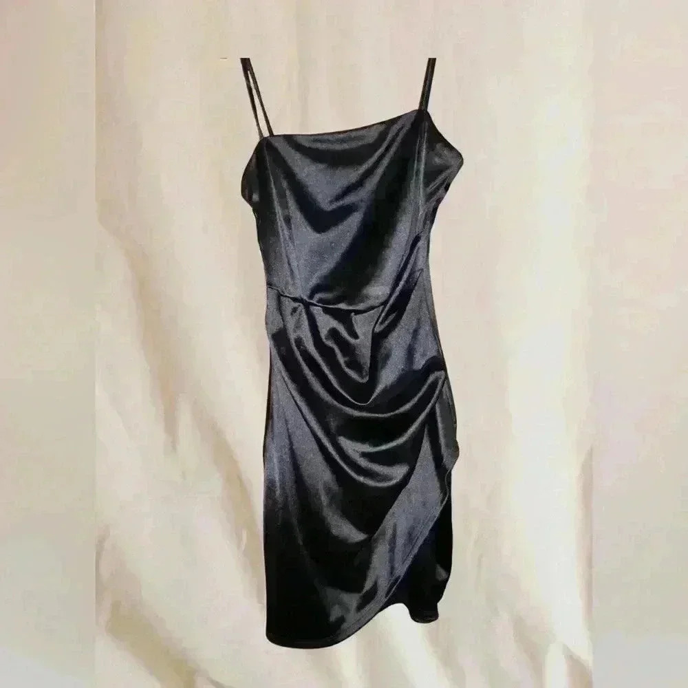 Spaghetti strap, black mini cocktail dress.